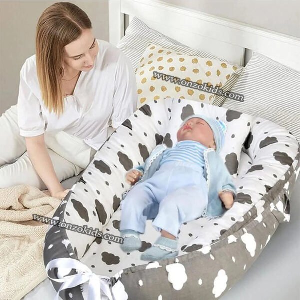 Nid bébé double face avec oreiller et drap